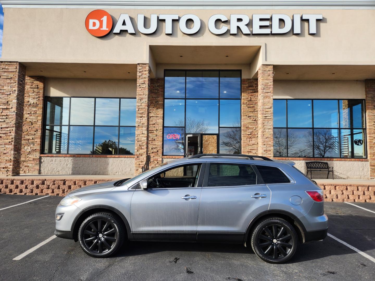 2010 Liquid Silver Metallic /Black Mazda CX-9 Grand Touring (JM3TB3MA6A0) with an 3.7L V6 DOHC 24V engine, Automatic transmission, located at 10890 W. Colfax Ave., Lakewood, CO, 80215, (303) 274-7692, 39.739914, -105.120132 - 2010 Mazda CX-9<br><br>D1 Auto NEVER charges dealer fees! All cars have clean titles and have been inspected for mechanical issues. We have financing for everyone. Good credit, bad credit, first time buyers.<br><br>Please call Lakewood Location 303-274-7692 or Thornton 303-287-5511 to schedule a tes - Photo#0